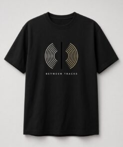 Between Tracks Vinyl Groove Unisex T-Shirt in black with cream-to-gold vinyl groove lines